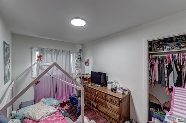 601 Haines Ct, Rapid City, SD 57701 - bedroom with a closet and dark wood-type flooring