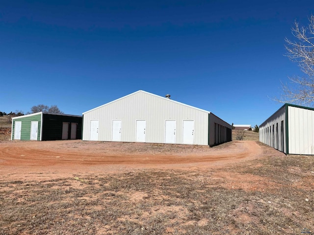 view of property exterior with an outdoor structure