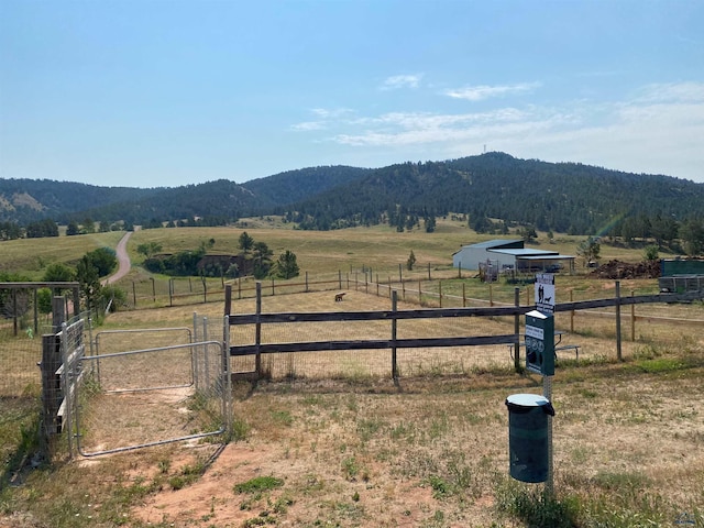 mountain view featuring a rural view