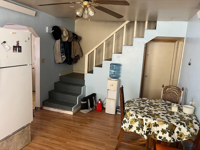 interior space featuring white refrigerator, ceiling fan, and hardwood / wood-style floors