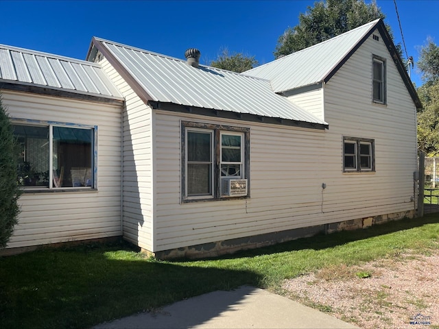 view of home's exterior featuring a yard