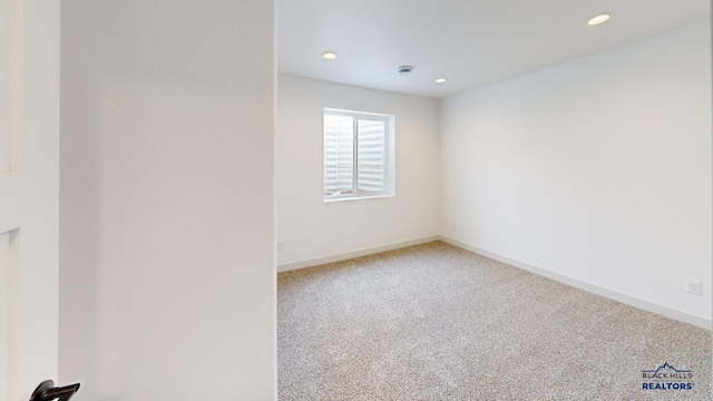 spare room with carpet floors