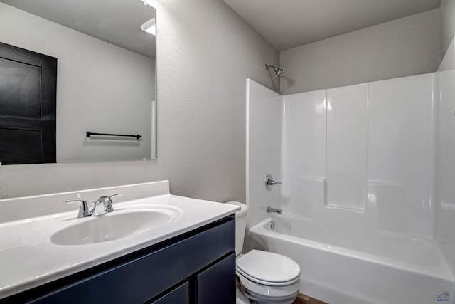 full bathroom with shower / washtub combination, vanity, and toilet