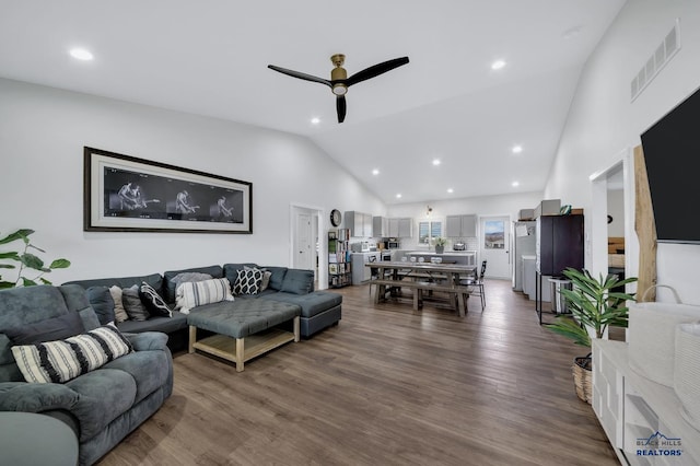 living room featuring high vaulted ceiling, ceiling fan, and hardwood / wood-style floors