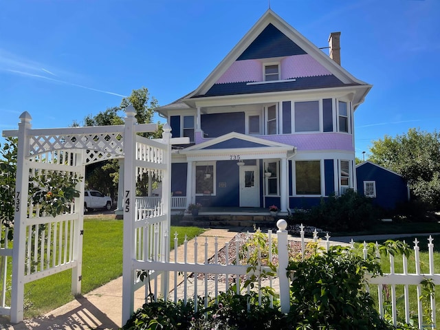 735 8th, Spearfish, SD 57783 - victorian house with a porch and a front lawn