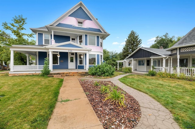 735 8th, Spearfish, SD 57783 - victorian-style house featuring a front yard and covered porch