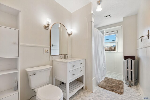 735 8th, Spearfish, SD 57783 - bathroom featuring tile flooring, toilet, and large vanity