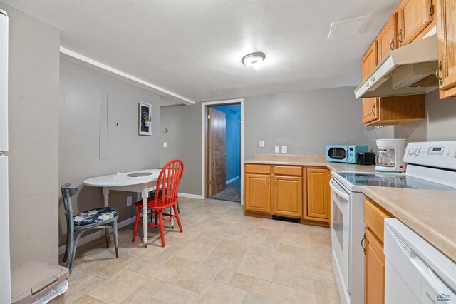 735 8th, Spearfish, SD 57783 - kitchen featuring white appliances and light tile floors