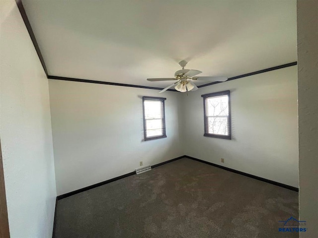 empty room featuring ceiling fan and carpet floors