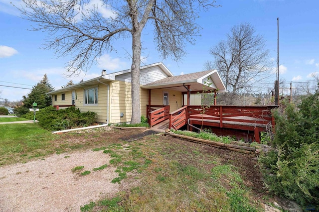 view of side of home featuring a deck