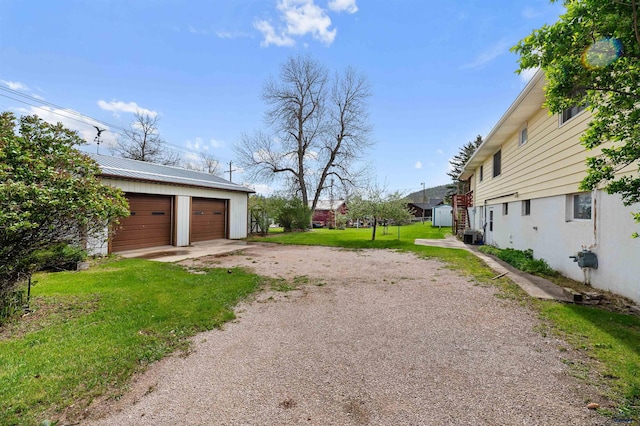 view of yard with a garage