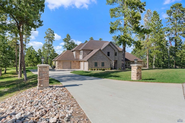 french country style house featuring a front yard