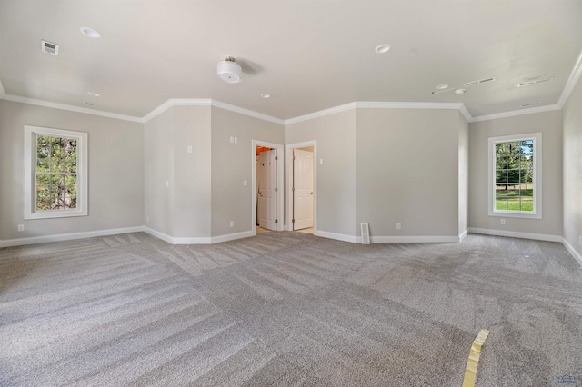 carpeted empty room featuring ornamental molding