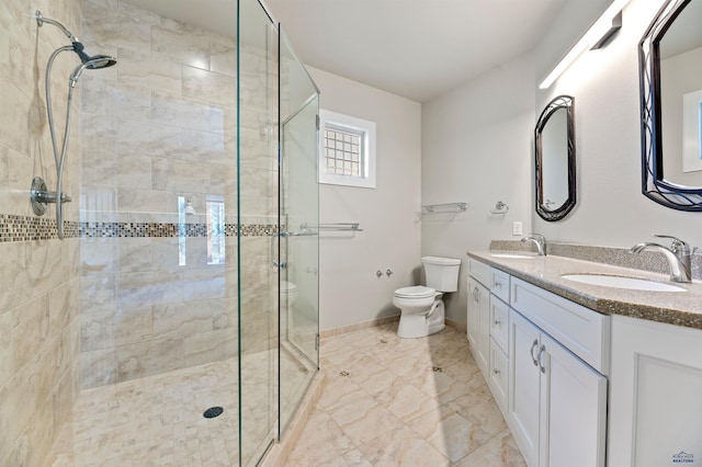 bathroom with dual bowl vanity, tile flooring, toilet, and a shower with door