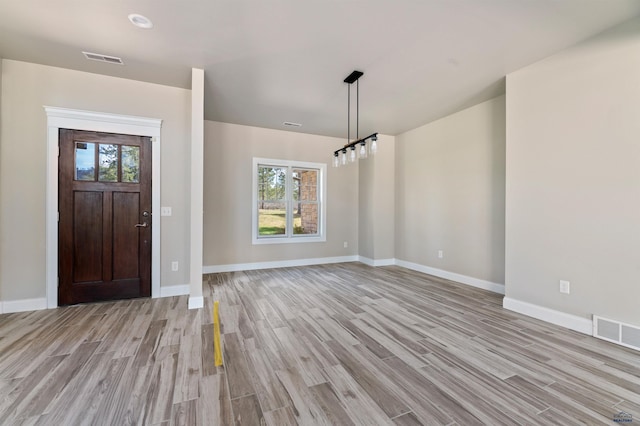 entrance foyer featuring a healthy amount of sunlight and light hardwood / wood-style floors