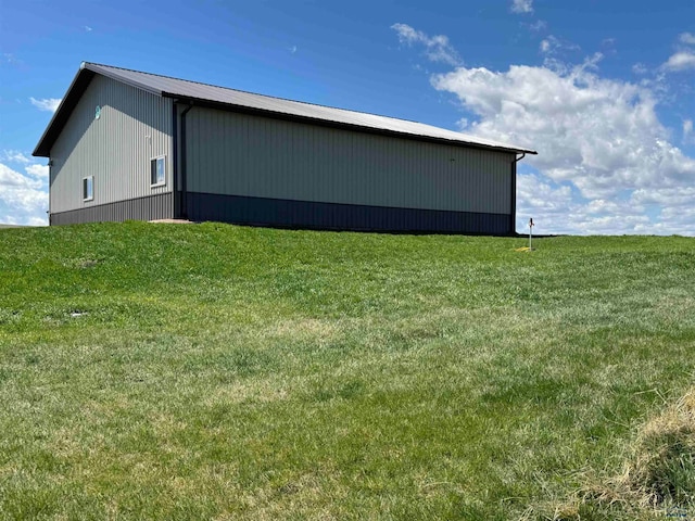 view of shed / structure with a lawn