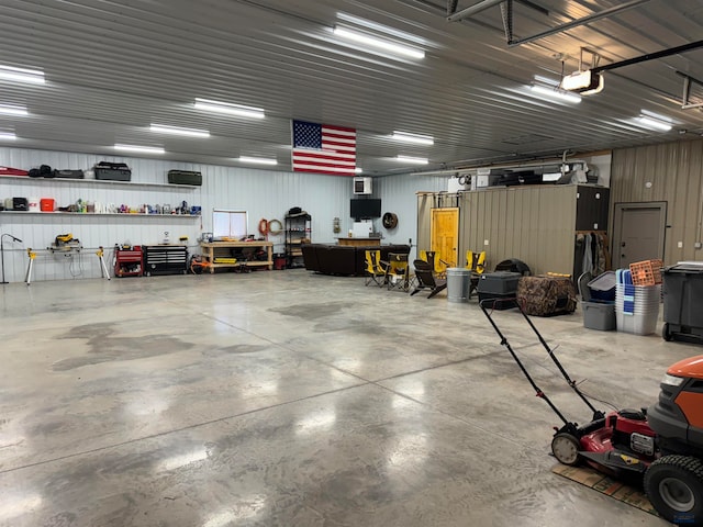 garage featuring a workshop area and a garage door opener