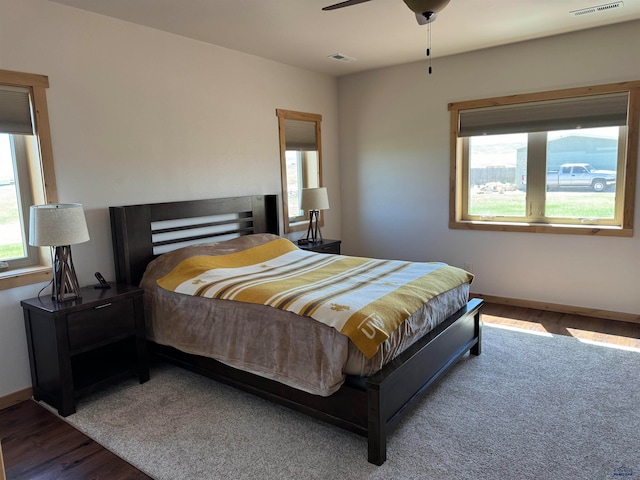 bedroom with wood-type flooring and ceiling fan