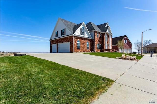 view of front of property with a garage and a front yard