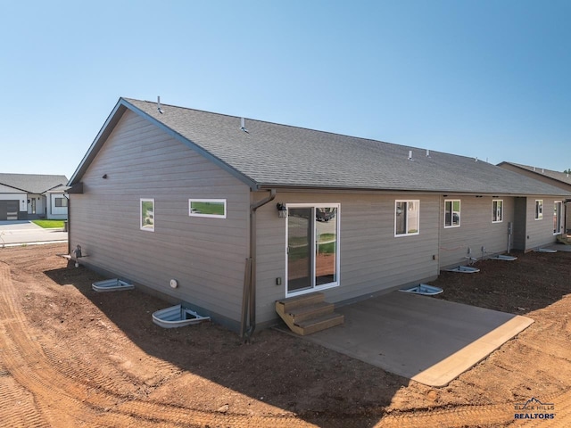 rear view of property featuring a patio area