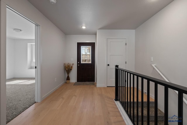 foyer entrance with light wood-type flooring