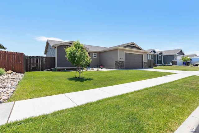 ranch-style home featuring a front yard and a garage