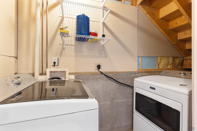 washroom featuring independent washer and dryer