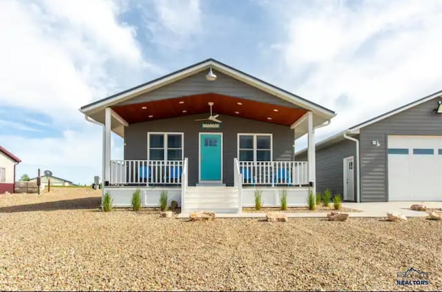 view of front facade featuring covered porch and a garage