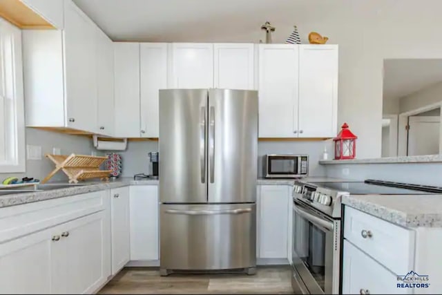 kitchen featuring white cabinets and stainless steel appliances