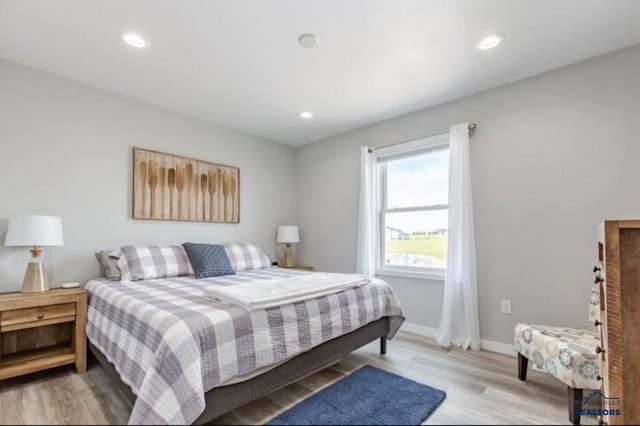 bedroom featuring light wood-type flooring