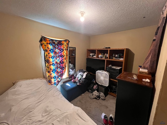 carpeted bedroom with a textured ceiling