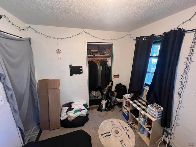 bedroom with a closet and a textured ceiling