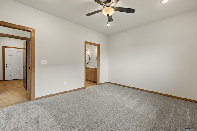 unfurnished bedroom featuring carpet, connected bathroom, and ceiling fan