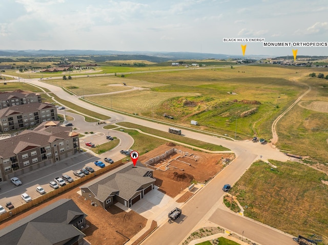 birds eye view of property featuring a rural view