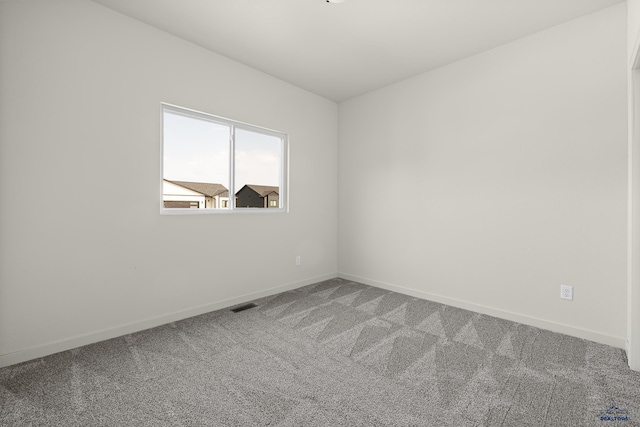 unfurnished room with carpet floors