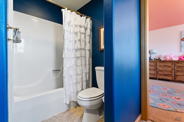 bathroom featuring shower / bath combination with curtain and toilet