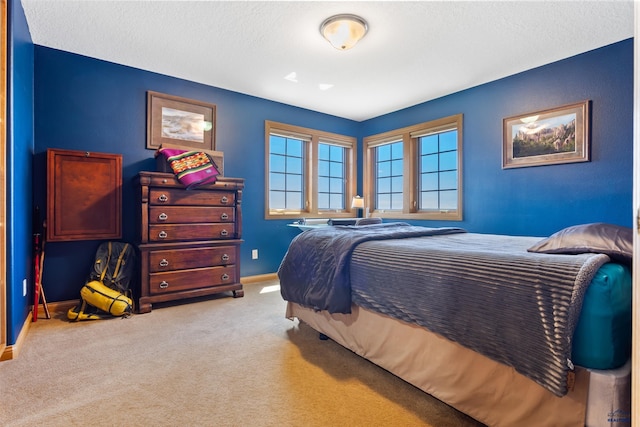 carpeted bedroom with a textured ceiling