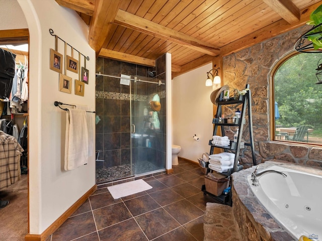 bathroom featuring beam ceiling, tile patterned flooring, shower with separate bathtub, and toilet