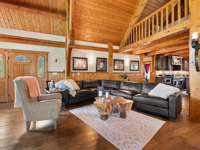 living room with beam ceiling, hardwood / wood-style floors, high vaulted ceiling, and wooden ceiling