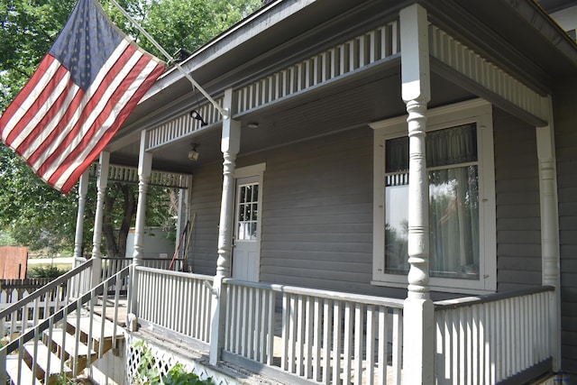 view of property exterior with a porch