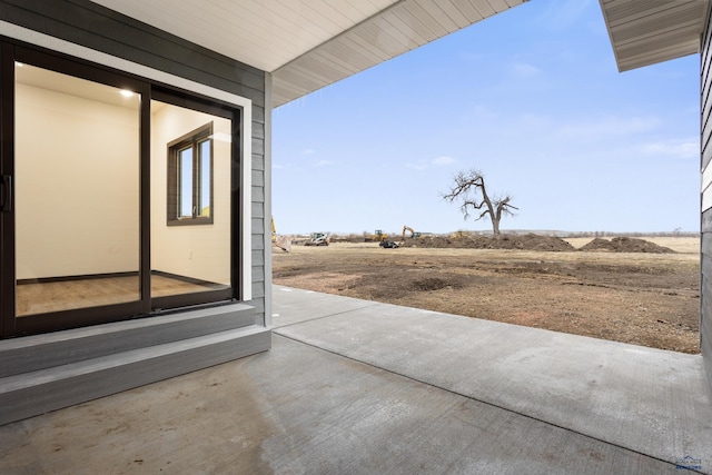 view of patio with a rural view