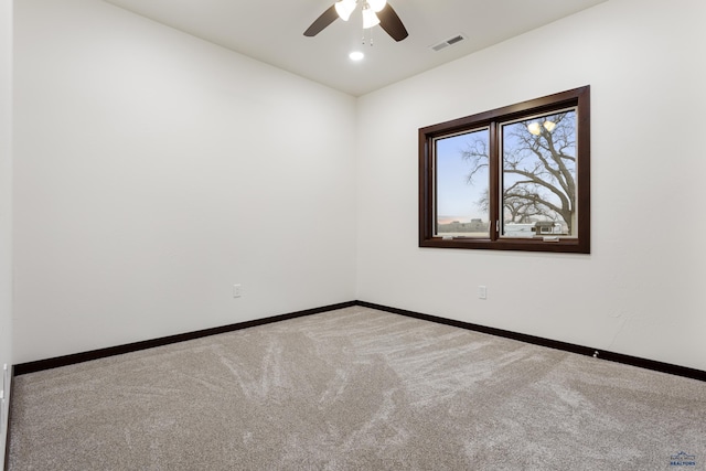 carpeted spare room featuring ceiling fan, recessed lighting, visible vents, and baseboards