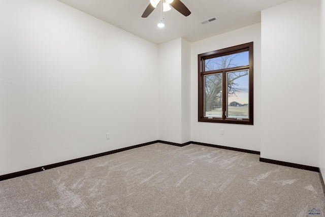 empty room with recessed lighting, light carpet, a ceiling fan, visible vents, and baseboards