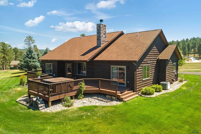 deck with a hot tub