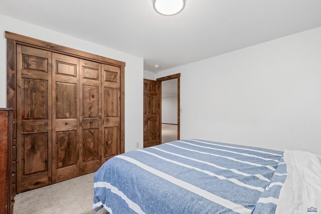 carpeted bedroom with a closet