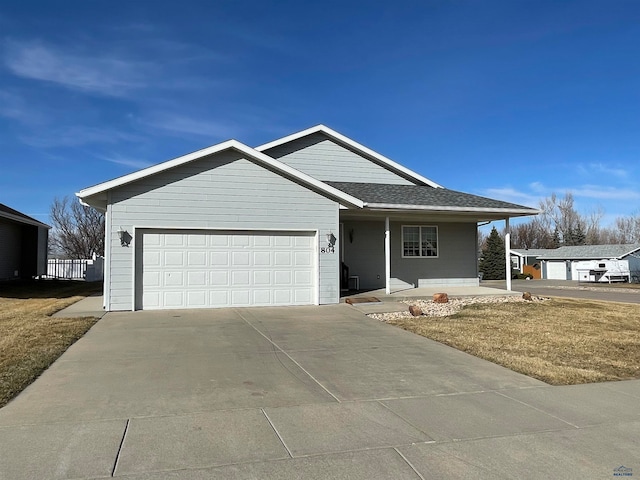 single story home with a front lawn and a garage