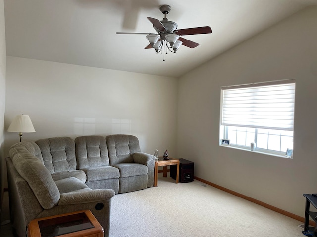 living room with ceiling fan, lofted ceiling, and carpet floors