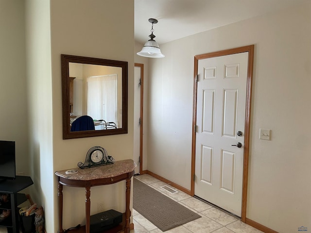 view of tiled foyer entrance