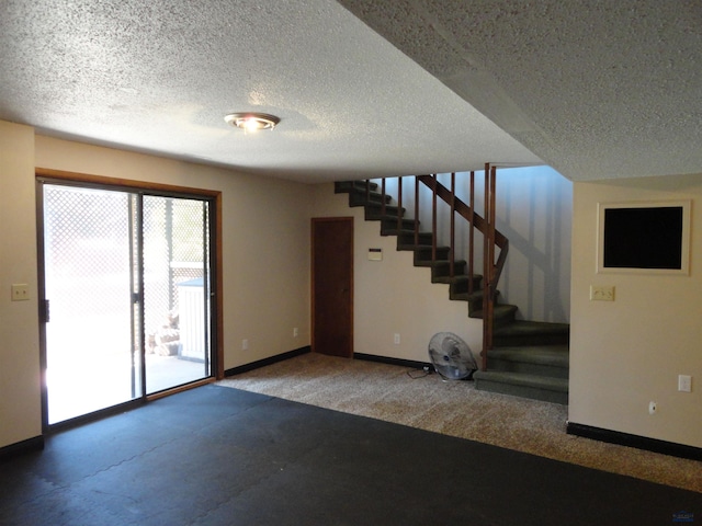 spare room with a textured ceiling