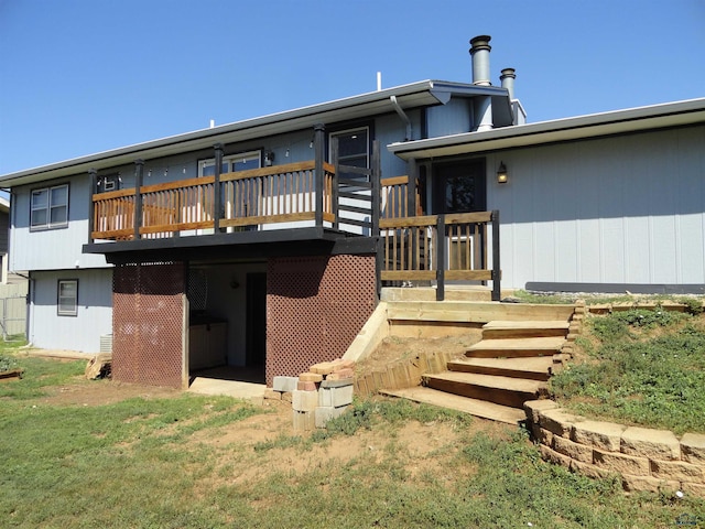 back of house featuring a deck